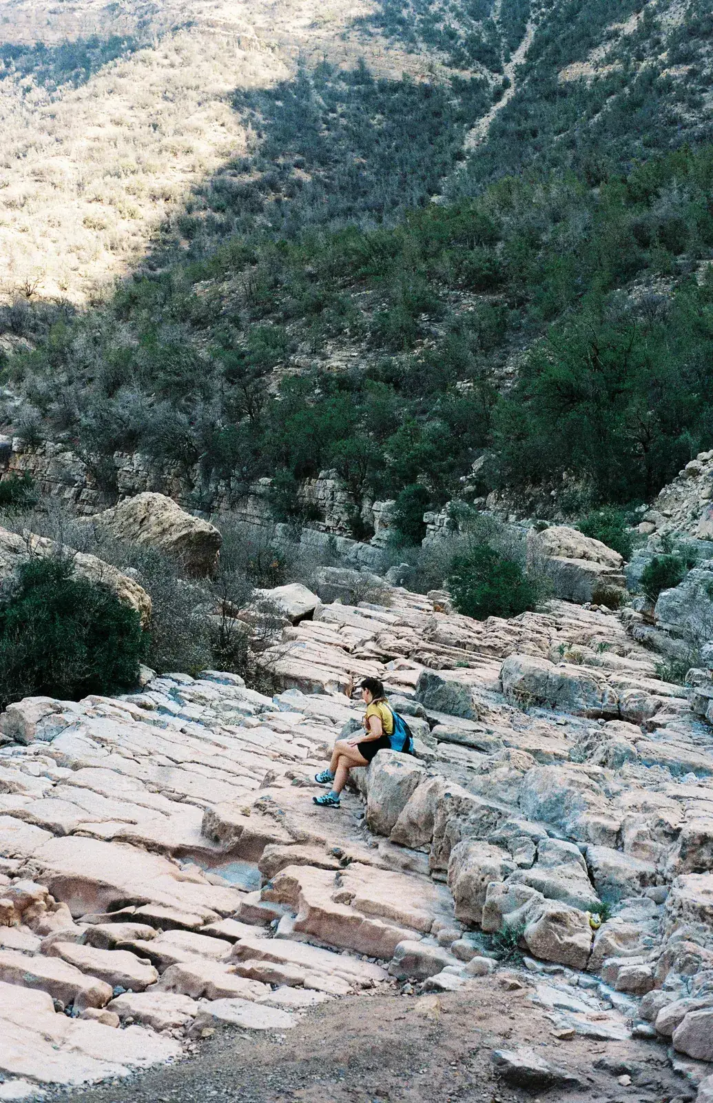 Guest resting on the rocks in the Paradise Valley canyon