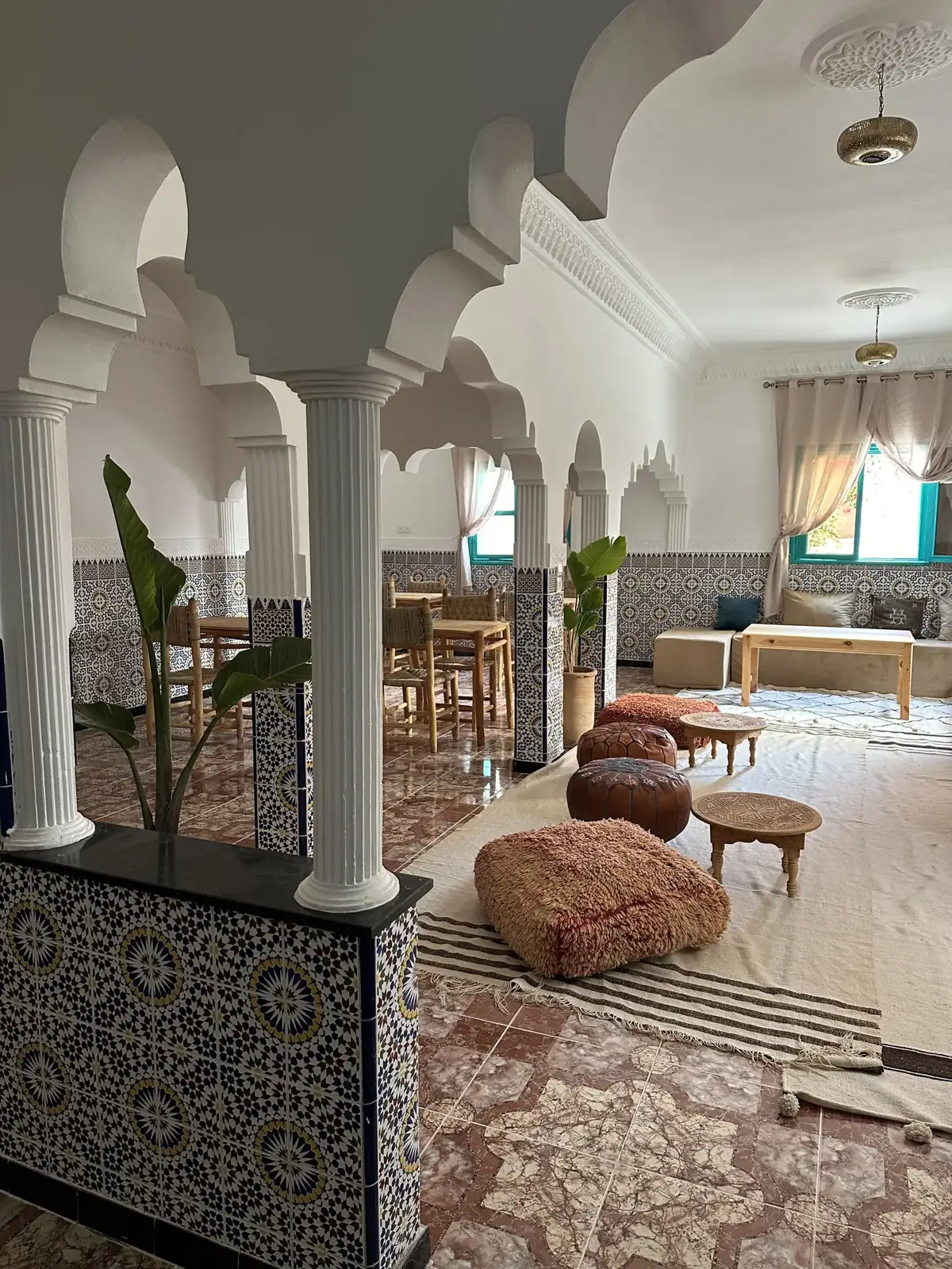 Courtyard lounge with horseshoe arches and zellige tiles