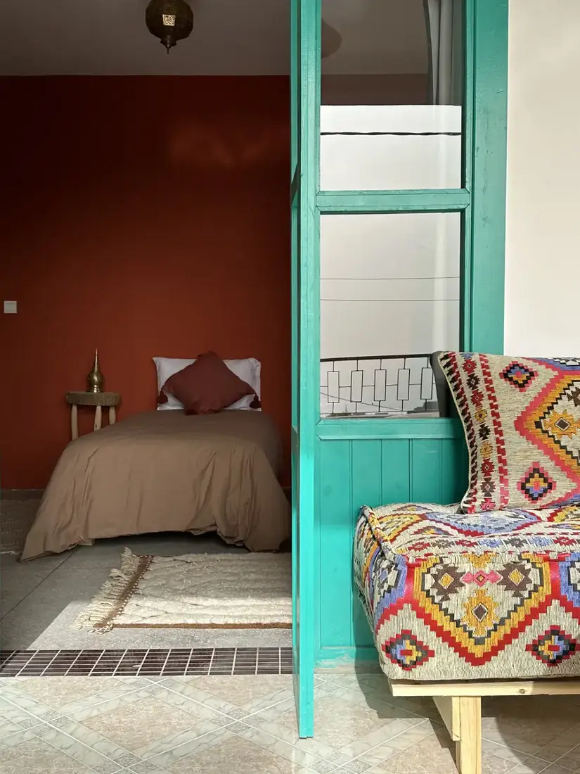 Turquoise doorway opening to a bedroom