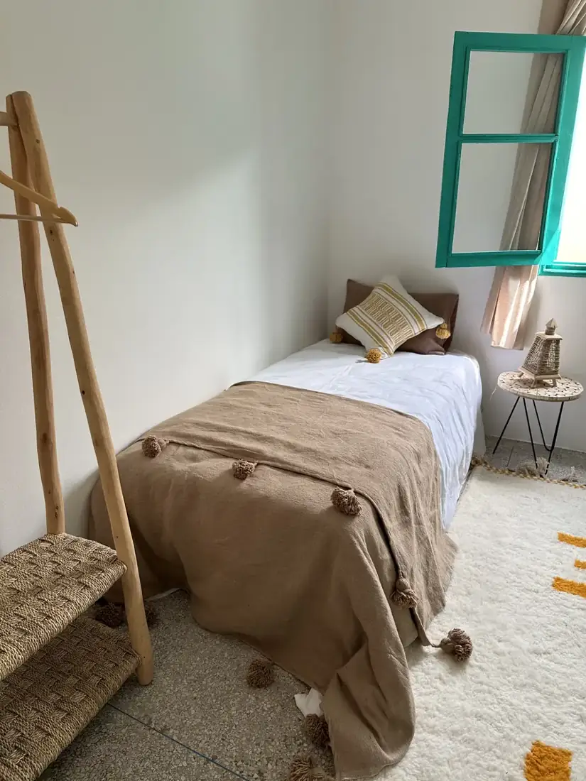 Medium Yellow Room with turquoise window
