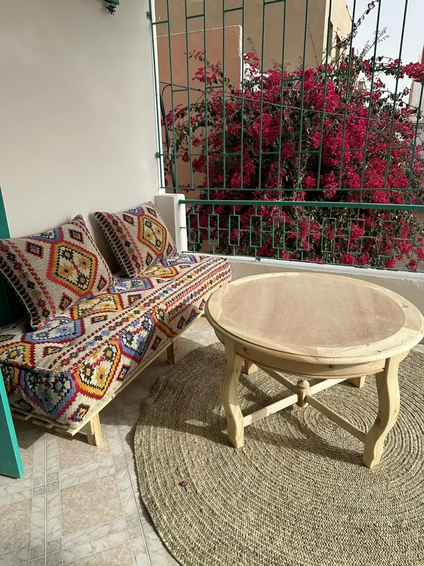 Olive Green Room terrace with Moroccan cushions