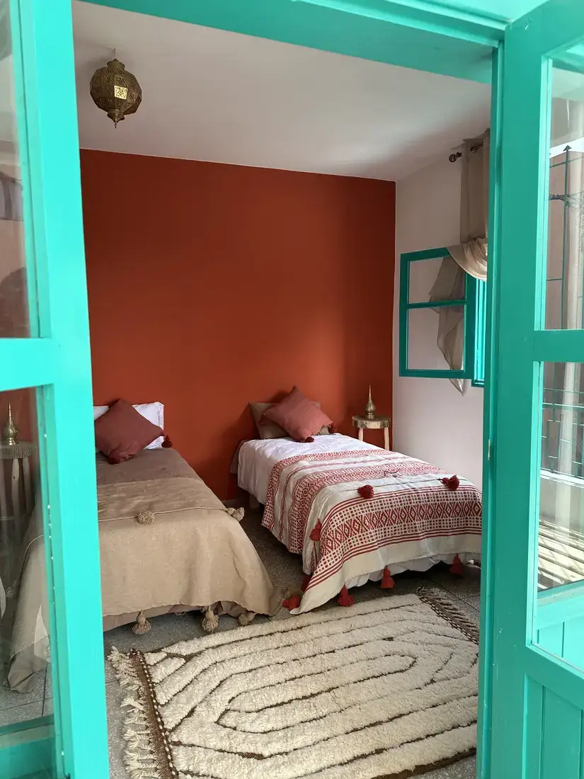 Riad bedroom behind a turquoise door