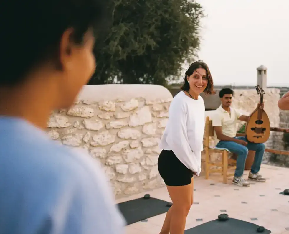 Rooftop yoga session with live oud music
