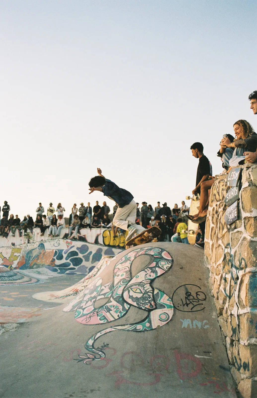 Skater carving the bowl at the Taghazout skatepark