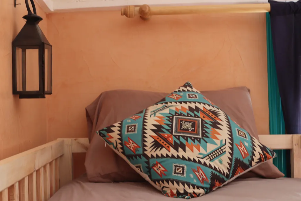 Patterned cushion and an iron lantern