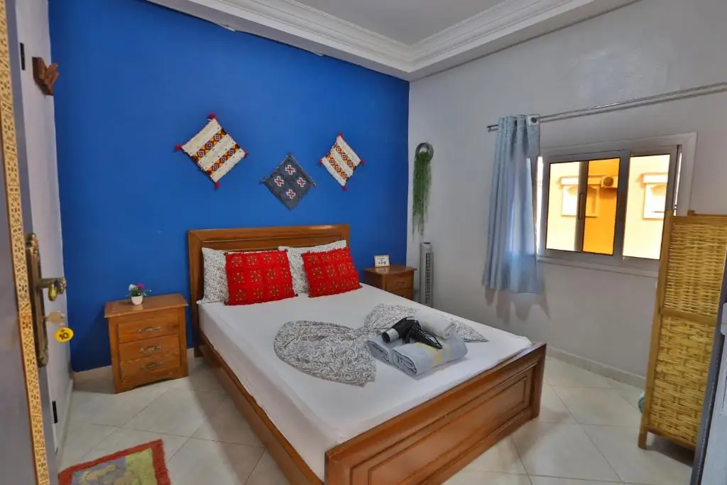 Blue double room with red Berber cushions