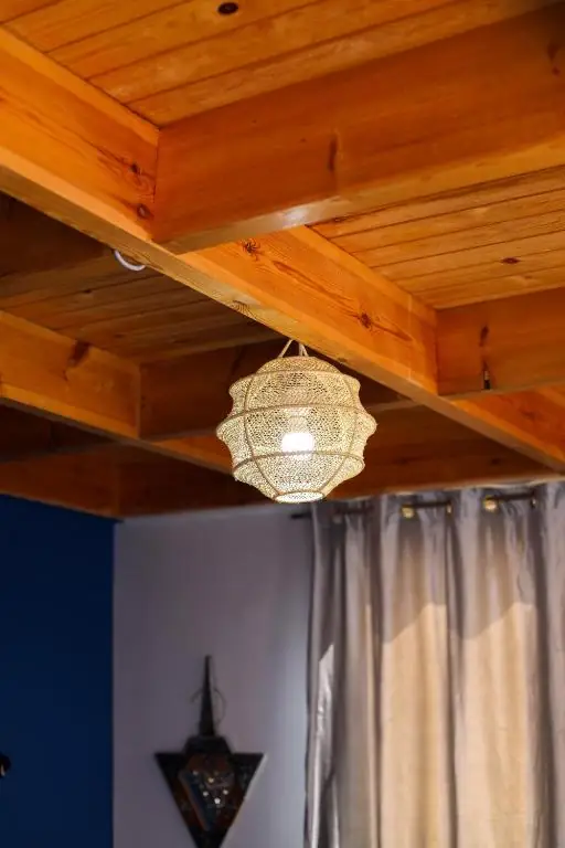 Rattan lamp under the cedar ceiling
