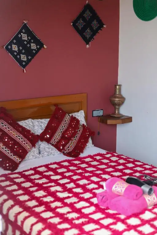 Bed with a pink check blanket