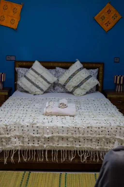 Bed with handira cushions