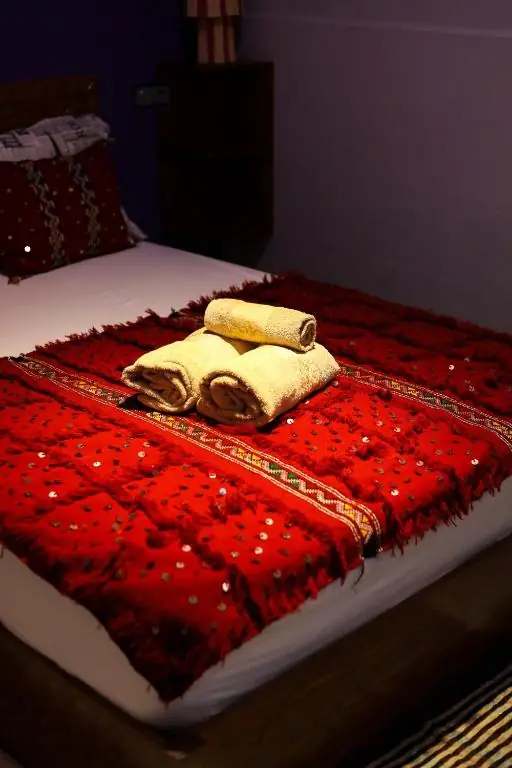 Towels on a red Berber blanket
