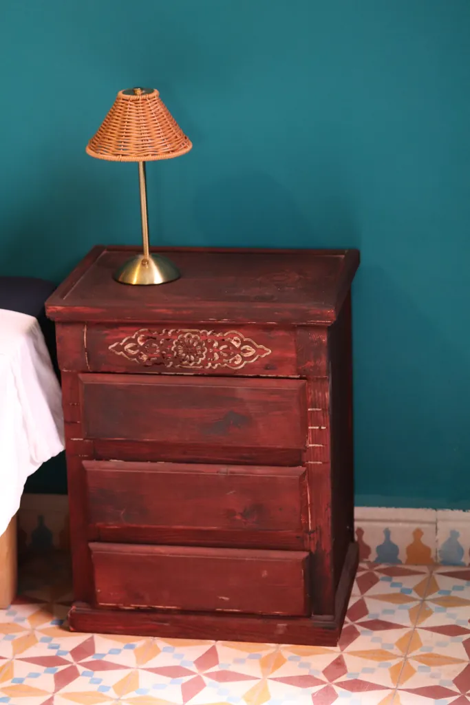 Carved wooden bedside table